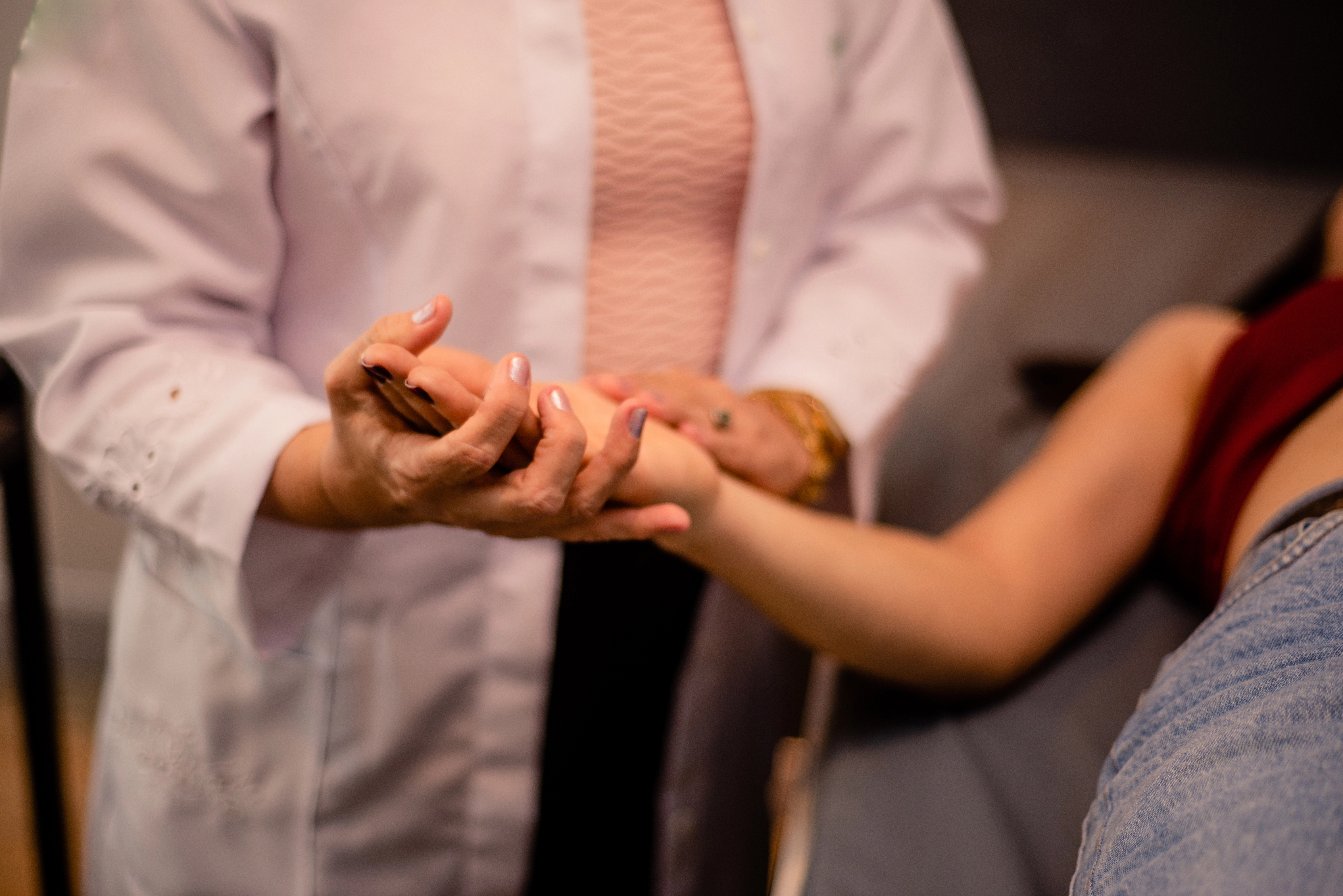 Doctor performing skin exam